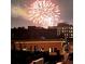 Nighttime view of buildings under a colorful fireworks display, illuminating the dark sky above the city rooftops at 1435 Wazee St # 504, Denver, CO 80202
