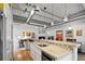 Well-equipped kitchen with breakfast bar overlooking living area and an industrial-style ceiling with track lighting at 1435 Wazee St # 504, Denver, CO 80202