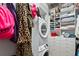Organized laundry room and walk-in closet combination with ample storage and modern machines at 1435 Wazee St # 504, Denver, CO 80202