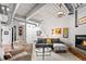 Living room featuring a fireplace, hardwood floors, modern furnishings and neutral colors at 1435 Wazee St # 504, Denver, CO 80202