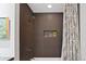 Elegant bathroom shower with large showerhead, tiled walls and convenient inset shelving at 1435 Wazee St # 504, Denver, CO 80202