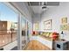 Bright and airy sitting area with large windows leading to a private balcony and built in bench at 1435 Wazee St # 504, Denver, CO 80202