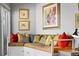 Cozy sitting nook featuring a built-in bench with colorful pillows and hardwood floors at 1435 Wazee St # 504, Denver, CO 80202