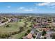 Expansive aerial view showcasing the community's lush green spaces and residential area at 2140 S Coors Cir, Lakewood, CO 80228