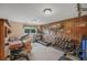 Basement gym featuring exercise equipment, wood-paneled walls, and natural light, promoting a healthy lifestyle at 2140 S Coors Cir, Lakewood, CO 80228