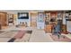Finished basement with a media area, custom wood desk, and ample storage, perfect for entertainment and organization at 2140 S Coors Cir, Lakewood, CO 80228