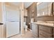 Well-lit bathroom featuring a stand-up shower, vanity, and granite countertop at 2140 S Coors Cir, Lakewood, CO 80228