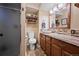 Cozy bathroom featuring a glass-enclosed shower, stylish vanity, and warm, earthy tones at 2140 S Coors Cir, Lakewood, CO 80228