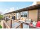 Outdoor deck with comfortable seating area perfect for relaxing or entertaining at 2140 S Coors Cir, Lakewood, CO 80228