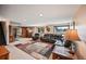 Spacious living room with carpet flooring, recessed lights, and two windows at 2140 S Coors Cir, Lakewood, CO 80228
