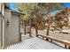 Winter backyard view with a snow-covered deck and privacy fence at 2112 Springs Pl, Longmont, CO 80504