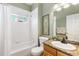 Bathroom featuring a shower-tub combo and a sink with a granite countertop, stylish and practical at 2112 Springs Pl, Longmont, CO 80504