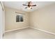 Neutral bedroom with a ceiling fan and a window for natural light at 2112 Springs Pl, Longmont, CO 80504