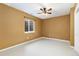 Neutral bedroom with a ceiling fan and bright window at 2112 Springs Pl, Longmont, CO 80504