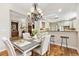 Dining room with a view into the kitchen, creating an efficient flow for meal serving and entertaining at 2112 Springs Pl, Longmont, CO 80504