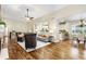 Open-concept living room connected to a kitchen and dining area, ideal for Gathering gatherings at 2112 Springs Pl, Longmont, CO 80504