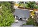 Aerial view of backyard featuring patio dining set, grassy area, and new roof at 1016 S Cook St, Denver, CO 80209