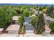 Aerial shot of home surrounded by mature trees, showcasing neighborhood and landscaping at 1016 S Cook St, Denver, CO 80209