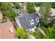 Aerial view of home with lush backyard, stone walkway, and mature landscaping at 1016 S Cook St, Denver, CO 80209