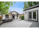 Inviting backyard with a dining area, patio, and well-maintained siding on a detached building at 1016 S Cook St, Denver, CO 80209