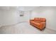 The finished basement features a warm leather couch and bright, clean flooring at 1016 S Cook St, Denver, CO 80209