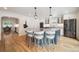 Contemporary kitchen with granite countertops, an island with seating, and lots of natural light at 1016 S Cook St, Denver, CO 80209