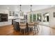 Modern kitchen featuring a large island with bar seating, stainless steel appliances, and ample counter space at 1016 S Cook St, Denver, CO 80209