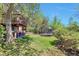 Spacious backyard area featuring a trampoline and multilevel deck at 3792 S Pitkin Ct, Aurora, CO 80013