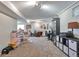 An open finished basement showcases neutral carpet, a play area, and practical storage solutions at 3792 S Pitkin Ct, Aurora, CO 80013