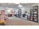 Finished basement with carpet, storage, shelving and space for a play area at 3792 S Pitkin Ct, Aurora, CO 80013