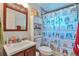 bathroom with cute owl shower curtain and wood vanity at 3792 S Pitkin Ct, Aurora, CO 80013