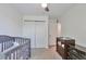 Bedroom with crib and changing table with ample closet space at 3792 S Pitkin Ct, Aurora, CO 80013