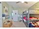 Bedroom with toy chest, whiteboard, and bunk bed at 3792 S Pitkin Ct, Aurora, CO 80013