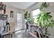 Cozy entryway featuring abundant plants, natural light, and wood-look floors at 3792 S Pitkin Ct, Aurora, CO 80013