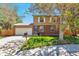 Beautiful home showcasing a well-kept lawn, brick and vinyl siding, plus a two car garage at 3792 S Pitkin Ct, Aurora, CO 80013