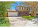 Charming two-story home with a brick facade, two-car garage, and well-maintained lawn at 3792 S Pitkin Ct, Aurora, CO 80013