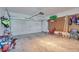 Spacious garage with a large white door, peg board on the wall, and ample storage space at 3792 S Pitkin Ct, Aurora, CO 80013