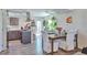 Bright eat-in kitchen features stainless hood vent and updated cabinets at 3792 S Pitkin Ct, Aurora, CO 80013