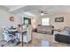 Open-concept living and dining area with ceiling fan and wood-look floors at 3792 S Pitkin Ct, Aurora, CO 80013