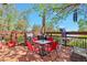 Relaxing outdoor patio area with red railings, umbrella, and a dining set at 3792 S Pitkin Ct, Aurora, CO 80013