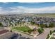 Aerial view of a Gathering-friendly neighborhood showcasing a park, playground, and well-maintained homes at 8768 E 54Th Pl, Denver, CO 80238