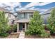 Charming two-story home featuring professionally landscaped front yard and welcoming front porch at 8768 E 54Th Pl, Denver, CO 80238