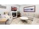 Cozy living room featuring a modern fireplace and comfortable seating arrangement at 8768 E 54Th Pl, Denver, CO 80238