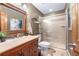 Charming bathroom with a vanity, framed mirror, glass-enclosed shower, and a tiled floor at 9001 Eastridge Rd, Golden, CO 80403