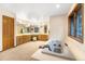 Bathroom features a large tub and separate vanities under large mirrors with vanity lighting at 9001 Eastridge Rd, Golden, CO 80403