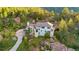 Stunning home nestled in the mountains with mature trees and natural rock landscaping at 9001 Eastridge Rd, Golden, CO 80403