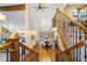 Open foyer with hardwood floors, wood staircase, chandelier and view of dining room at 9001 Eastridge Rd, Golden, CO 80403