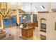 View of kitchen island and breakfast nook beyond, featuring stylish chandelier at 9001 Eastridge Rd, Golden, CO 80403