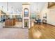 Bright open floorplan features a kitchen with island and adjacent dining area at 9001 Eastridge Rd, Golden, CO 80403