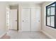 Cozy bedroom with neutral walls, plush carpets, modern closet and a window bringing in ample sunlight at 1559 N Hooker St, Denver, CO 80204